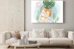 Obraz: Little safari lion playing with a leaf