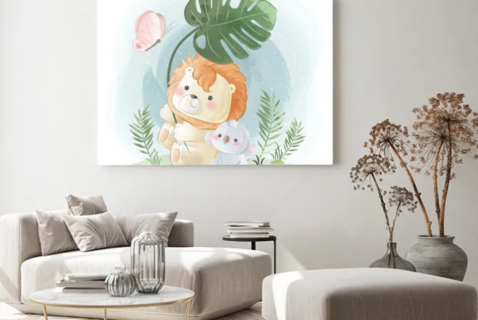 Obraz: Little safari lion playing with a leaf