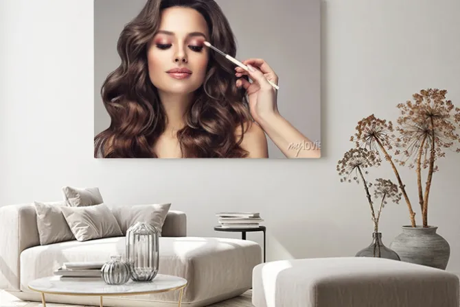 Obraz: Makeup artist applies eye shadow . beautiful woman with make-up