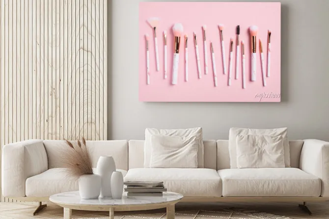 Obraz: Professional makeup brushes kit on pink background top view.