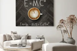 Obraz: The cup of black energy coffee with milk and two funny formulas.