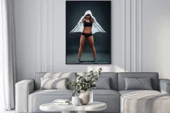 Plakat: Attractive athletic young woman posing in studio on dark backgro