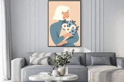 Plakat: Beauty woman with blond hair holding a bouquet of spring flowers.