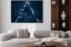 Plakat: Creative fluorescent color layout made of blue tropical leaves