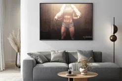 Plakat: Fitness woman after hard workout training holding white sports