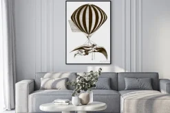 Plakat: Historic aerialist wearing wings while suspended from a balloon.