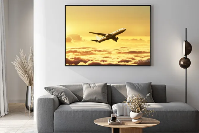 Plakat: Samolot na niebie o zachodzie słońca