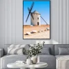 Plakat: Wiatrak na tle błękitnego nieba